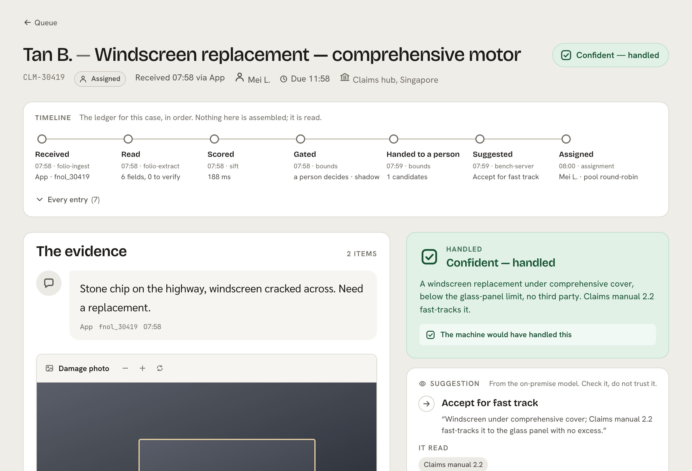 The REMIT case screen for a motor claim: first notice of loss and the damage photo read into a case record, handled and routed to fast track.